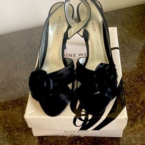 Black satin with flower details worn once to a wedding